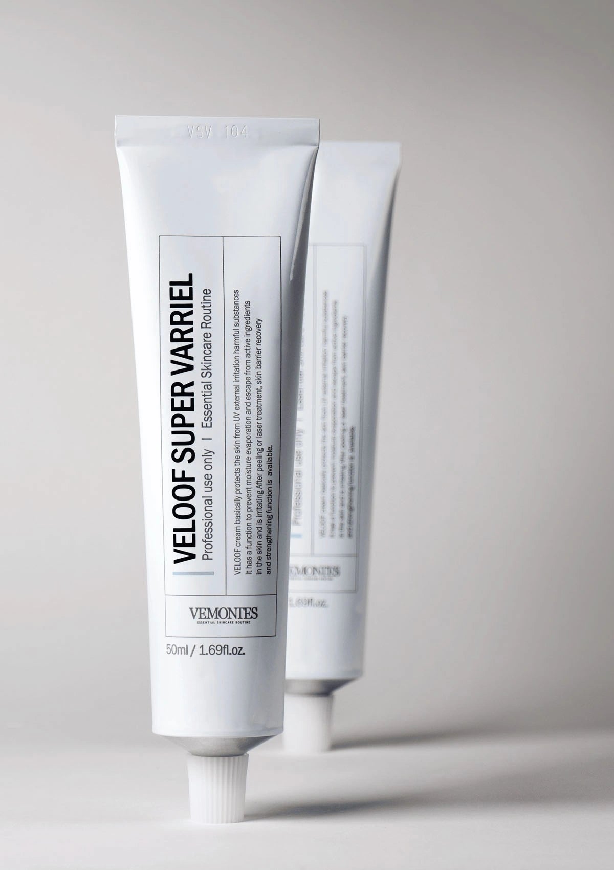 Two white tubes of Vel oven Super Varriel on a gray background